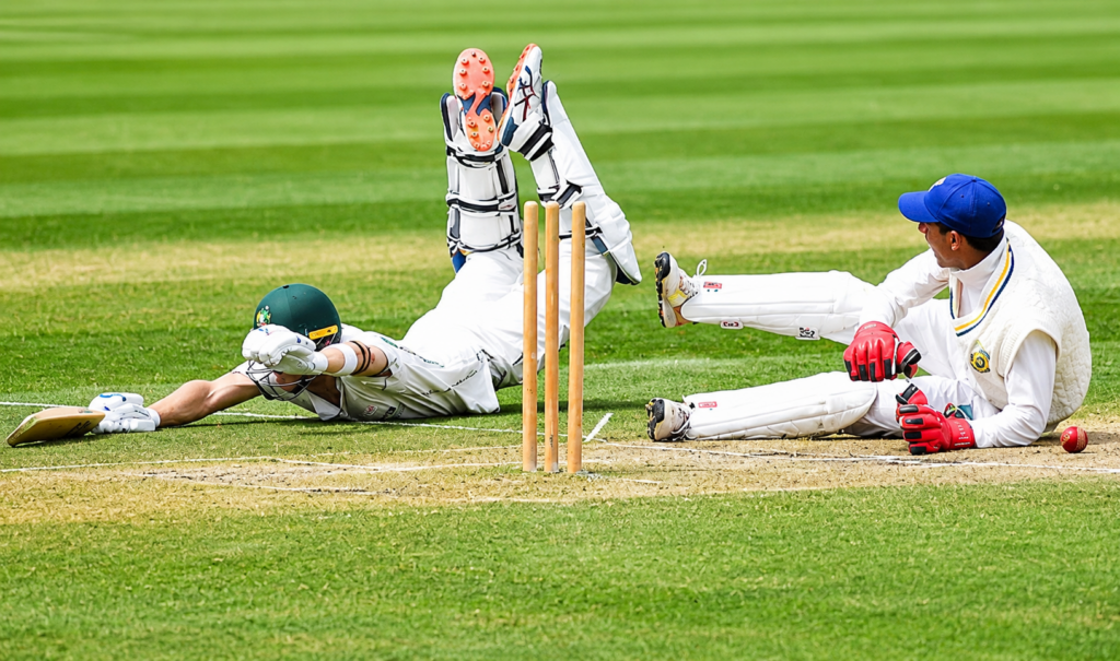 Batter diving to make ground during a close run-out attempt in a dead ball situation in cricket