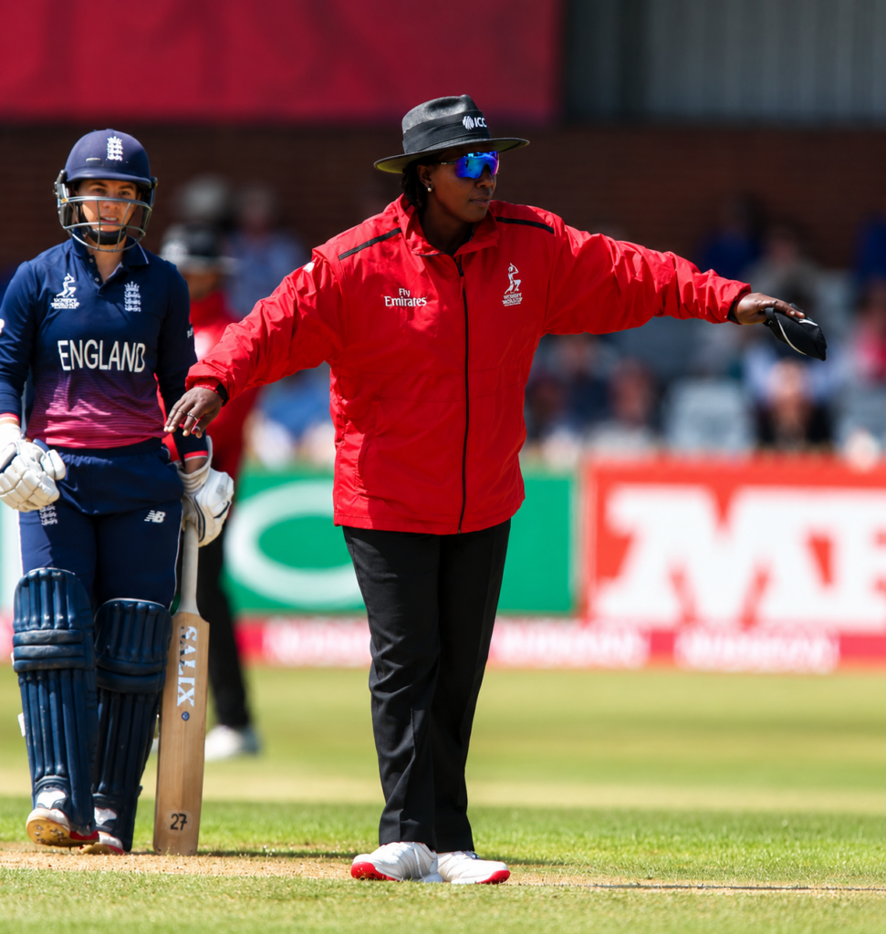 Umpire calling dead ball during a professional cricket match with batter standing at the crease